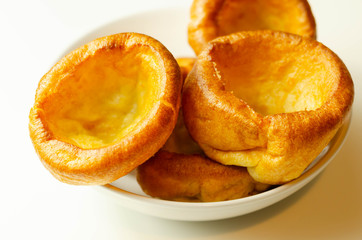 Traditional English Yorkshire pudding, wonderfully crisp and golden baked for a traditional recipe, accompaniment for the perfect Sunday roast