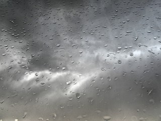 drops of rain on the window as a background