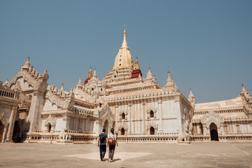 Couple walking around the Ananda Temple, Bagan, Mynmar, Burma