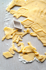 Cutting cookie dough. Forming baking dough with a cookie cutter. Selective soft focus.