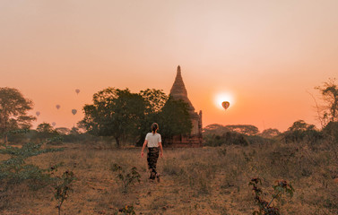 Woman watches the sunrise in Bagan, Myanmar