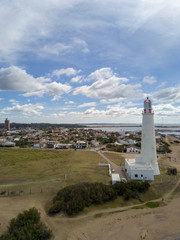 Aerial view of the lighthouse of La Paloma, the town next to it. Located in Rocha, Uruguay.