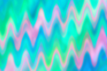 An abstract psychedelic wavy pastel colored blur background image.