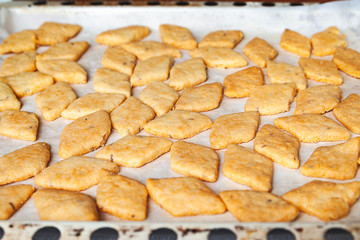 Freshly baked cookies. A lot of hot cookies on a baking sheet. Selective soft focus.
