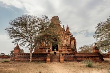 Tourist walks around a temple in Bagan, Myanmar