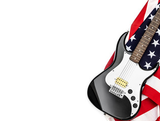 Obraz premium Electric guitar on american flag. Isolated on white. Space for text.