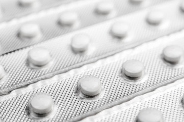 Pills in blister. Medical and pharmaceutical background. Close up.