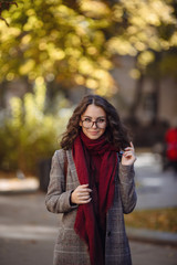 fashion outdoor photo of sensual woman walking by autumn city