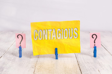 Writing note showing Contagious. Business concept for transmissible by direct or indirect contact...
