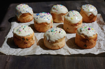 Easter cake muffin on a wooden table baking paper top view side view with topping