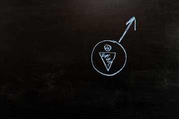 The symbol of Mars on the blackboard. Drawing of the male gender symbol.