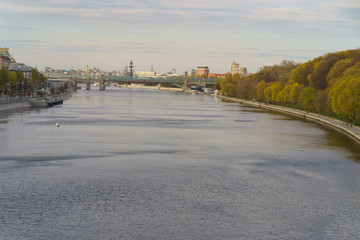 Moskva River embankment, Gorky Park is popular for walking. Coronavirus pandemic. Rest for nature.  Peter the Great Statue, Kremlin, Andreevsky (Pushkinsky) pedestrian bridge in distance