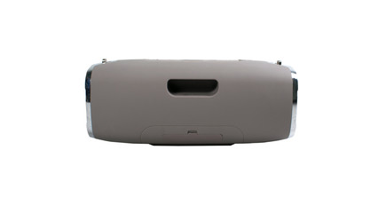 Portable grey speaker with the removable soft handle. Connect with smartphone or pc to play the music. Close up,