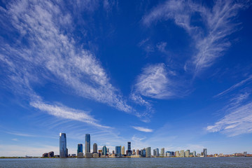 Fototapeta premium Jersey City skyline with skyscrapers over Hudson River viewed from New York City Manhattan downtown