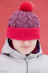 Woman in big purple knitted hat