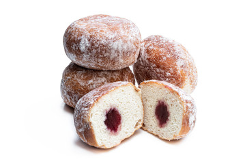 Freshly baked doughnuts stuffed with strawberry jam isolated on white