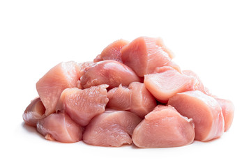 Raw chicken breast fillet chunks isolated on white