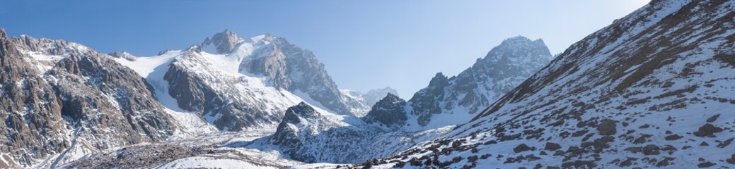 Fototapeta na wymiar High snowy mountains landscape panorama