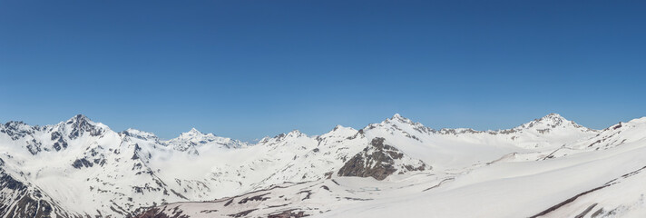 Fototapeta na wymiar High mountains panorama with clear blue sky