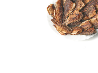 fried fish in a white plate top view