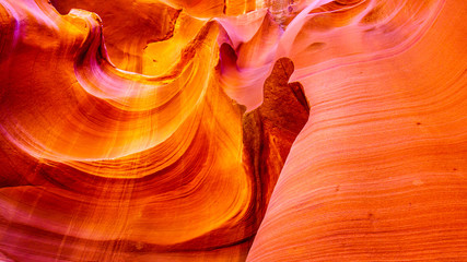 Thumbs Up. A thumb shape carved by erosion in the smooth curved Red Navajo Sandstone walls of Owl Canyon, one of the famous Slot Canyons in the Navajo lands near Page Arizona, United States