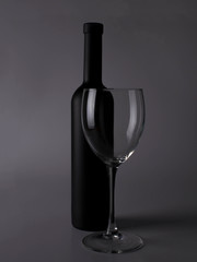 Wine glasses on black backround and wine bottles