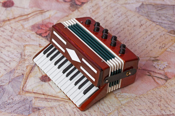 Classical musical instrument, miniature toy bayan (accordion)  with keyboard and buttons
