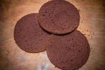 Chocolate cake on a wooden background. 