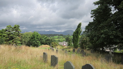 Fototapeta na wymiar hillside graveyard cemetery headstones