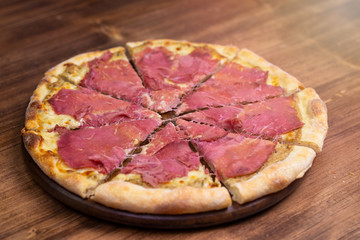 bresaola pizza with porcini mushroom sauce