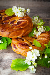 Braided bread with strawberry and spring flowers