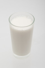 Milk glass close up on gray background