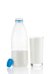 Milk glass and plastic bottle isolated on white background