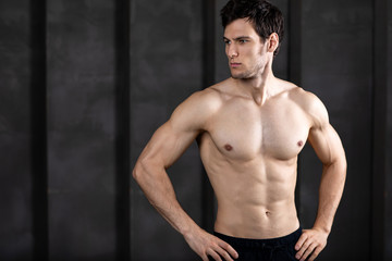 Fototapeta na wymiar Strong athletic man fitness model.