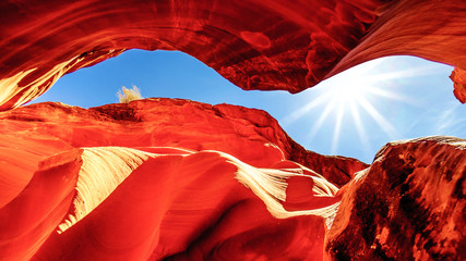 Sun rays over Owl Canyon, one of the famous Slot Canyons in the Navajo lands near Page Arizona, United States