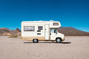 vintage camping bus, rv camper van in desert landscape -