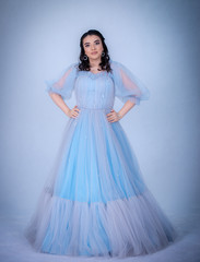 young beautiful model in the image of princesse ,cinderella dressed in a blue dress