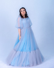 young beautiful model in the image of princesse ,cinderella dressed in a blue dress