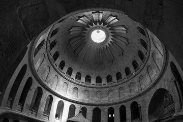 Dome in the Church of the Holy Sepulcher. The old city of Jerusalem. Black and white photo. A ray...