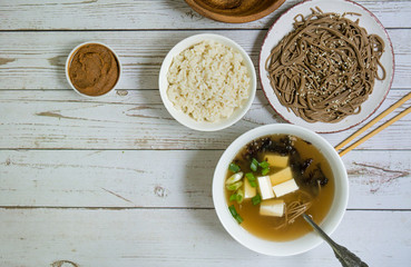 Miso soup with tofu and greens, made from stock and miso paste, algae