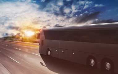 Grand tour bus moving fast on the highway at sunset © alphaspirit