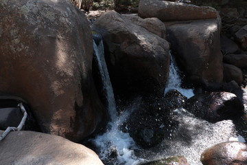 Water fallings over rocks in the mountains