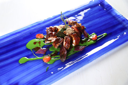 High Angle View Of Food Served In Blue Plate On Table