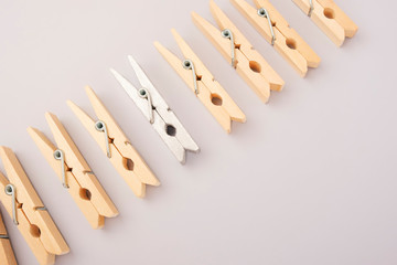 Silver wooden clothespin - difference in crowd, think differently, individually and stand out from...