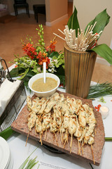 chicken on a stick with mustard sauce