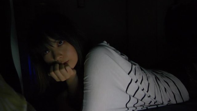Asian Girl Lies in Bed while Watching You in Dark Room, 4K