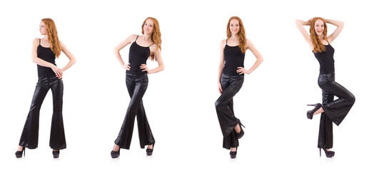 Redhead woman in black bell bottom pants on white