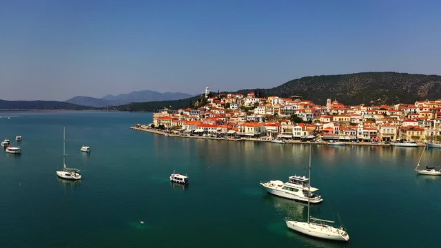 Yaht and boats around Poros city, Poros Island aerial view 4k