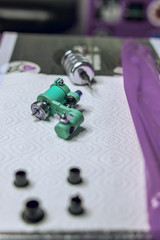 tattoo machine close-up on the table at the tattoo master prepared before the session, tattoo salon, safety of the procedure