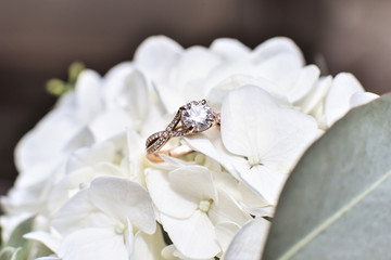 Engagement ring on flowers.
